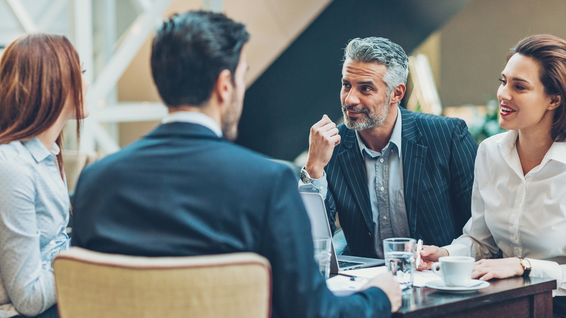 An image of two business consultants meeting with a a local Toronto small business owner.