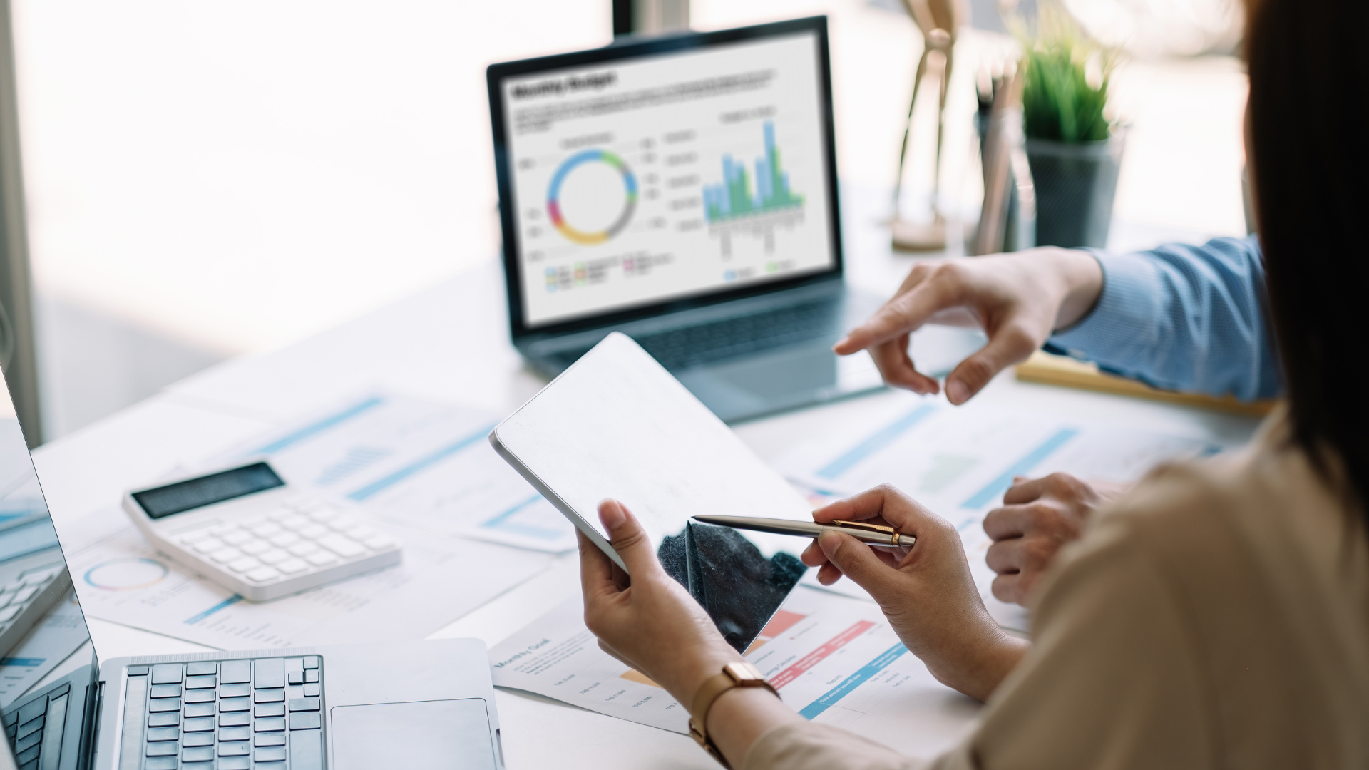 An image of two chartered professional accountants in Toronto working together on an owner managed business file.
