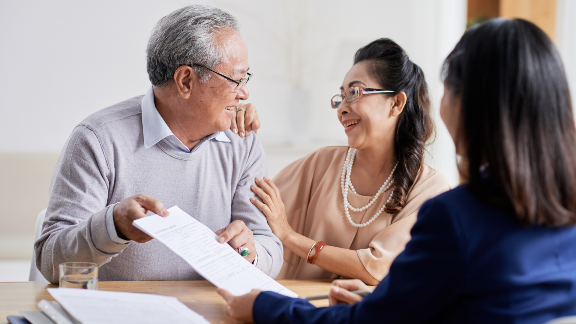 Two small business owners who are meeting with their tax advisor to discuss how to leverage Capital Gains as part of their estate plan.