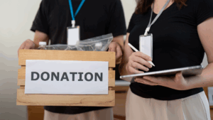 An image of two Etobicoke business owners providing Charitable Donations to a local non for profit