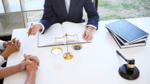 An image of a corporate lawyer in South Etobicoke who is chatting with her accounting team to understand more about Net Profit Margin for their law practice.