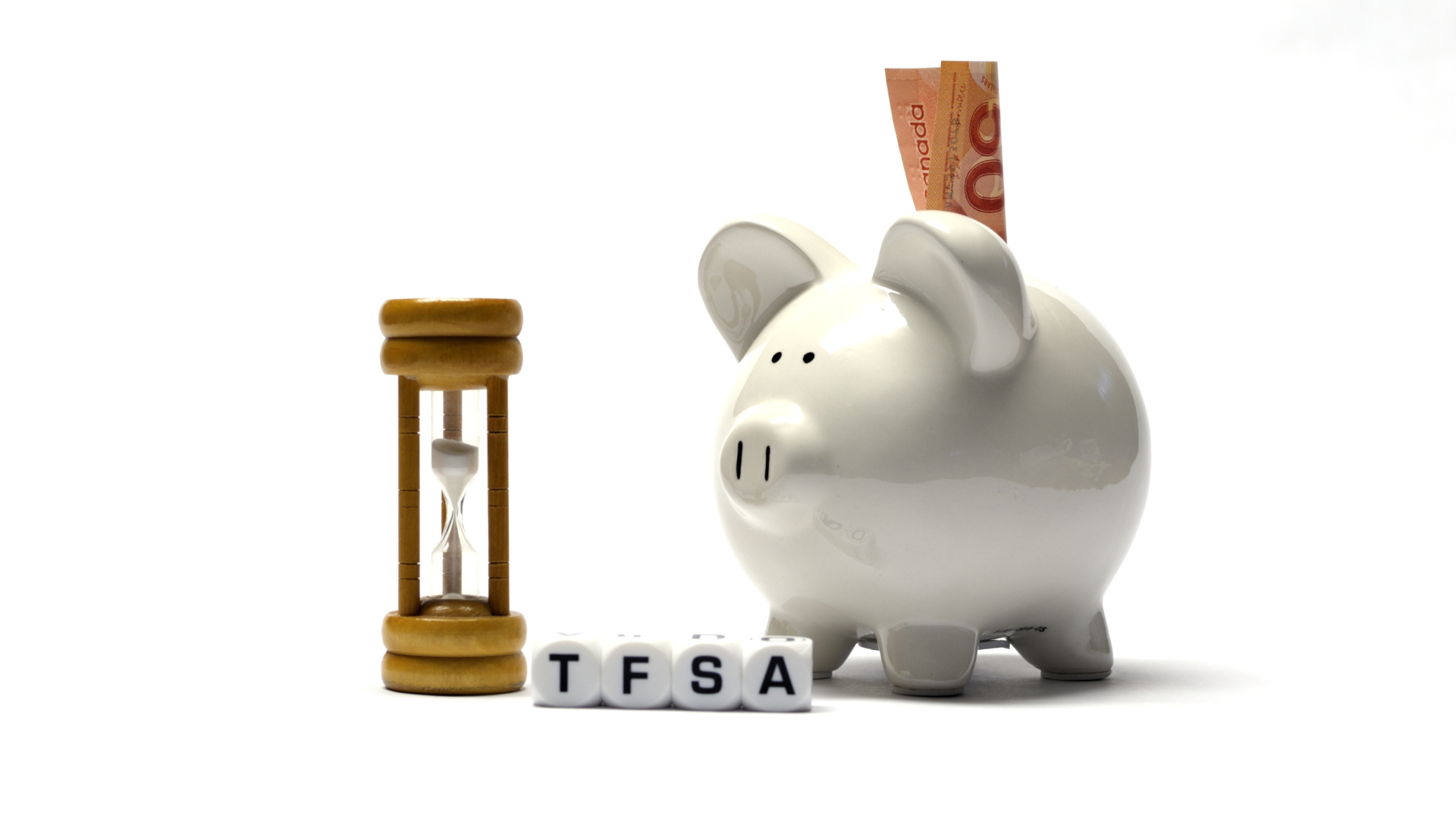 An image of a piggie bank and the block letters TFSA