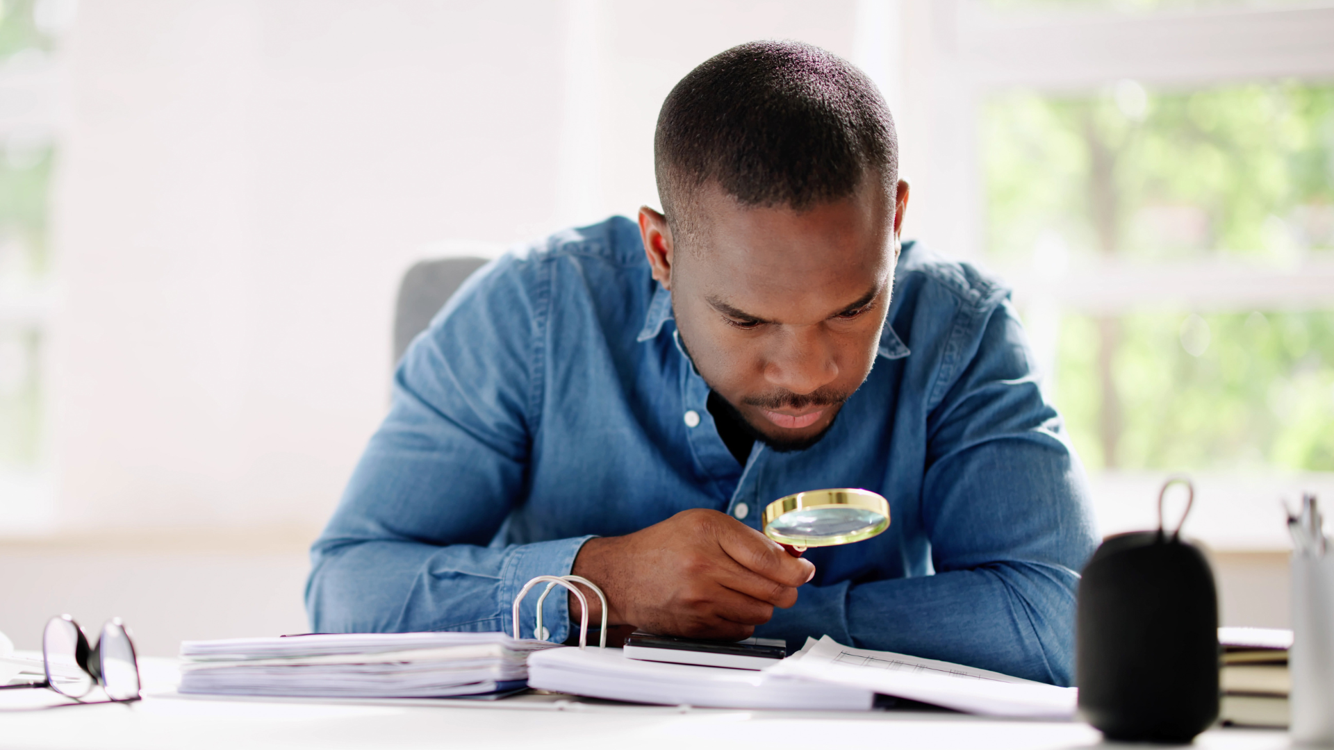 An image of a small business owner in Etobicoke reviewing his expenses to optimize his tax refunds