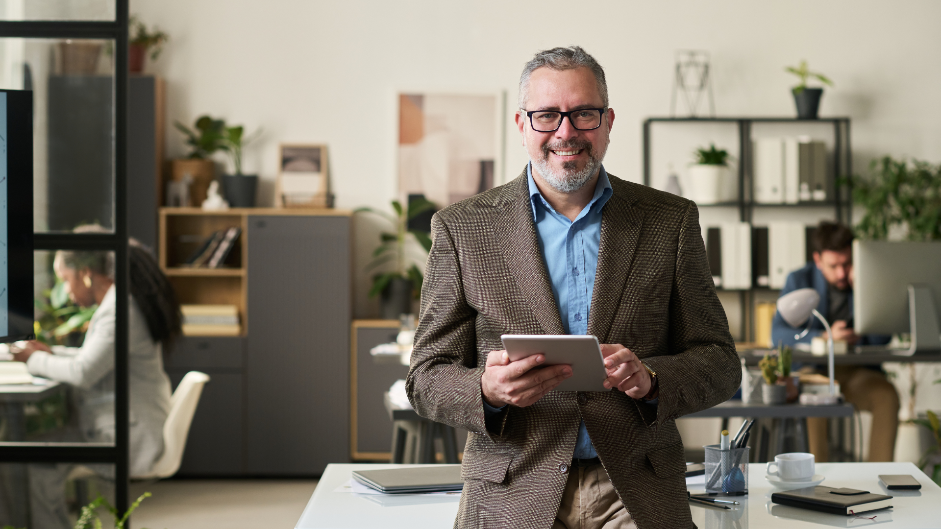 An image of a happy small business owner in South West Toronto who recently was advised by his local CPA to set up a holding company
