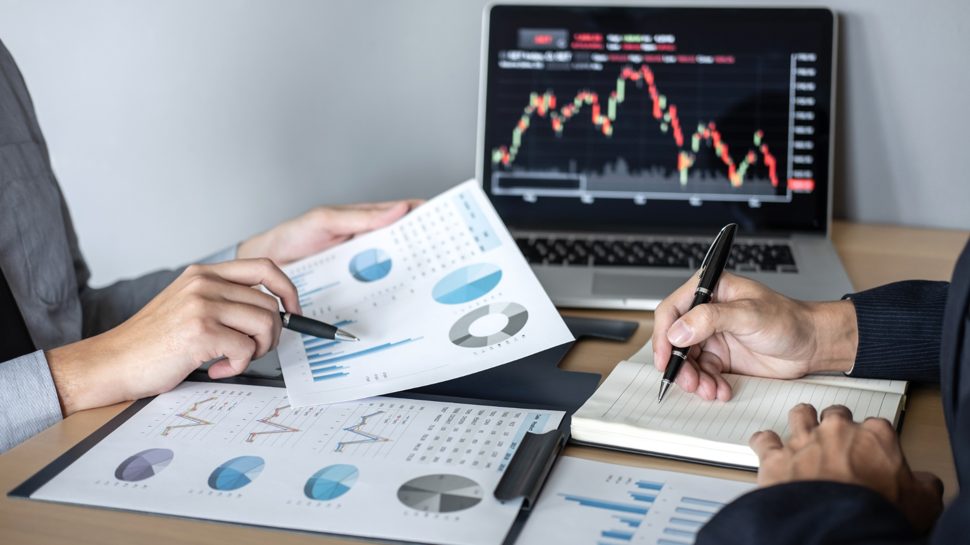 An image of a financial advisor reviewing a client's investment income for 2026